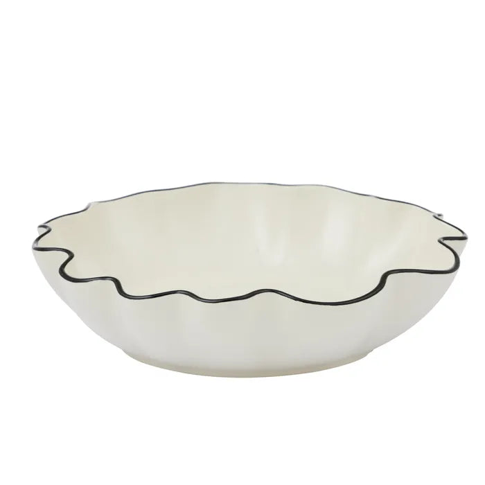 White ceramic bowl with black rim on a white background